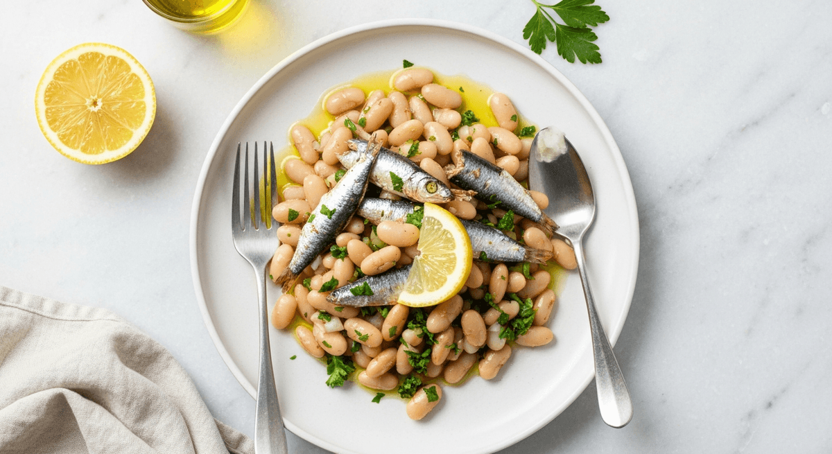 White bean salad with sardines, herbs, and lemon dressing in a bowl